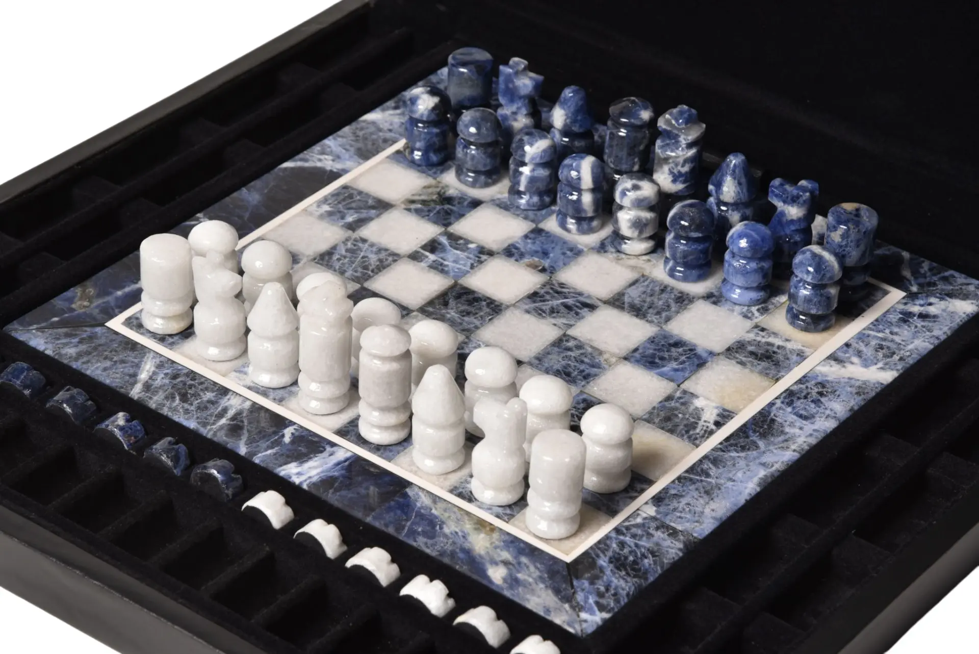Chessboard in blue sodalite and white marble with the pieces in place